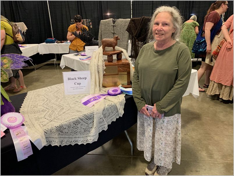 Margo Siebenmorgen, with her Shetland Stars Shawl, winner of this year's Fiber Arts Black Sheep Cup. Photo: Kristi Gustafson.